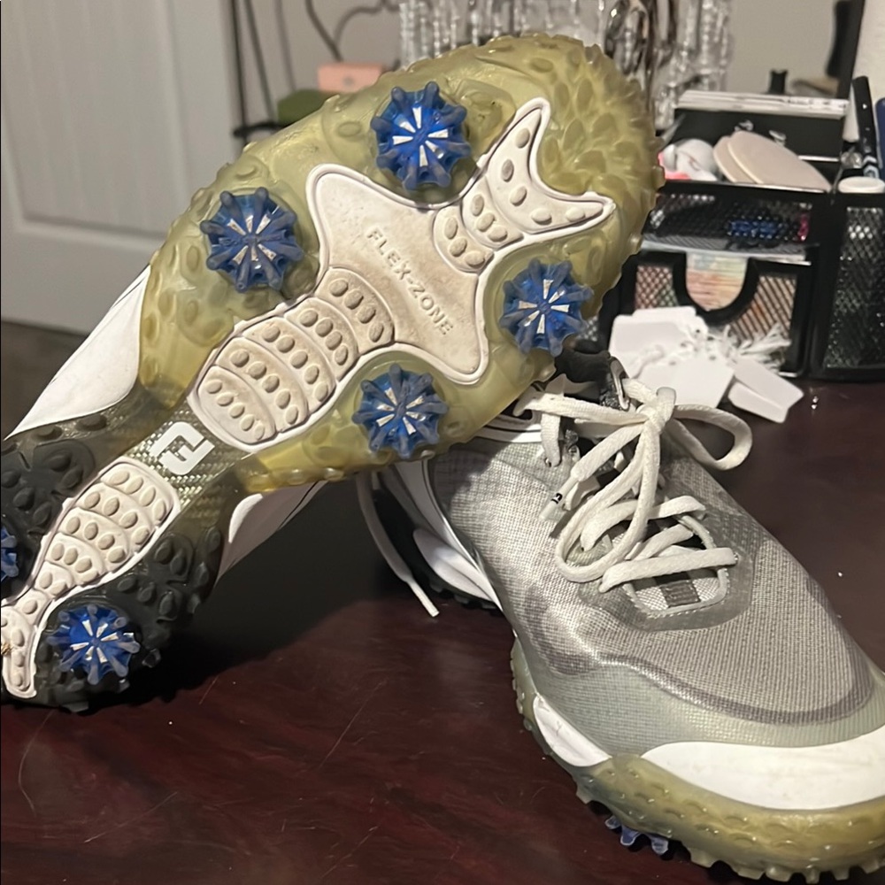Gray and White Golf Shoes with Blue Spikes